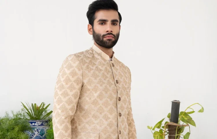 A Pakistani Man, wearing Prince Coat, looking in the camera